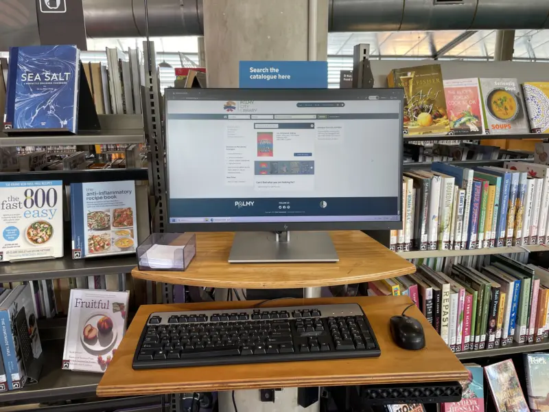 a catalogue computer mounted to a concrete pole in non fiction area of Central Library